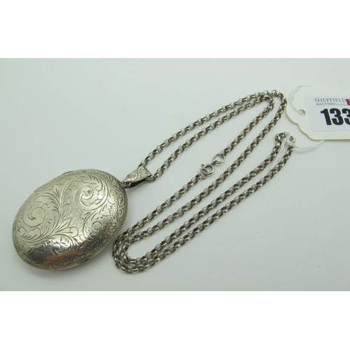 133 - A Large Hallmarked Silver Oval Locket Pendant, (import marks for London 1978) allover leaf scroll en... 