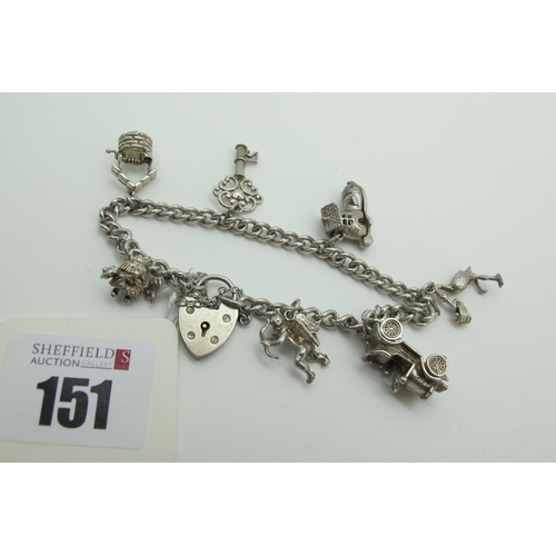 151 - A Curb Link Charm Bracelet, to hallmarked silver heart shape padlock style clasp, suspending novelty... 