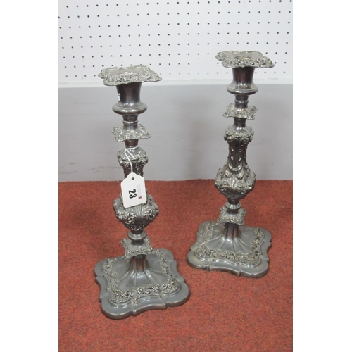 23 - A Pair of Antique Style Plated on Copper Candlesticks, each with acanthus leaf decoration and remova... 