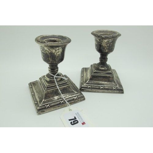 79 - A Pair of Hallmarked Silver Dwarf Candlesticks, (makers marks rubbed) Birmingham 1924, with ribbon a... 