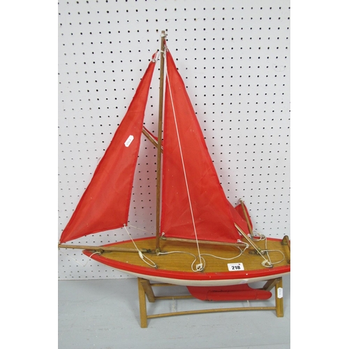 218 - A Nauticalia (Shepperton-On-Thames) Wooden Model Pond Yacht, measuring approximately 56cm long, 60cm... 