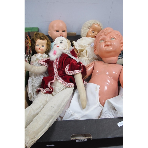 228 - Four Toy Dolls, all clothed, plus a boy doll with detached parts, all playworn and displaying signs ... 