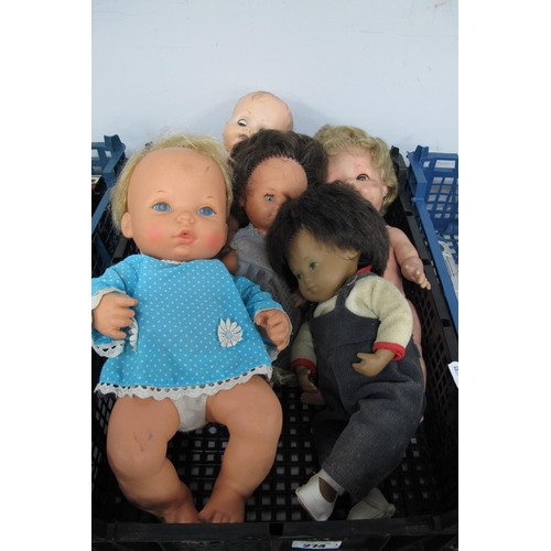 274 - A Collection of Five Modern Dolls,to include a Sasha Baby Doll approximately 29cm high.