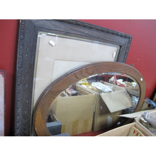 1005 - An Oak Oval Shaped Wall Mirror, together with an early XX Century framed photograph of a lady. (2).