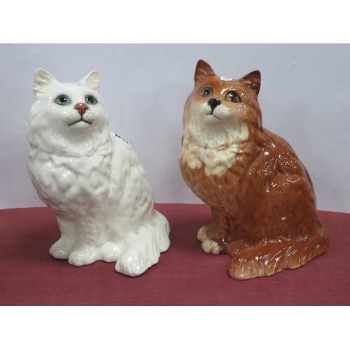 1267 - Beswick Pottery Seated Cats, in white and brown, 20cm high. (2).