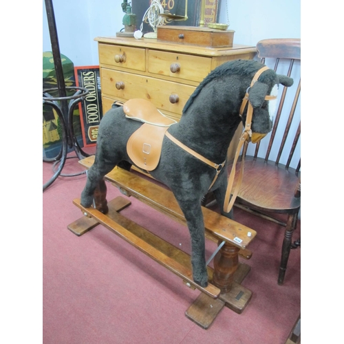 1638 - Mamas and Papas Brown Plush Rocking Horse, with leather saddle and reigns, on stained wooden base, 1... 