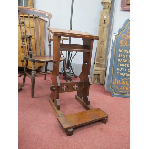 1645 - An Early XX Century Walnut Gothic Kneeler, with a sloping top, on shaped supports, with a quarter fo... 