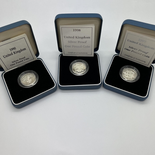 41 - Three Silver Proof Royal Mint £1 Coins, 1990, 1997, and 1998, all cased with certificate of authenti... 