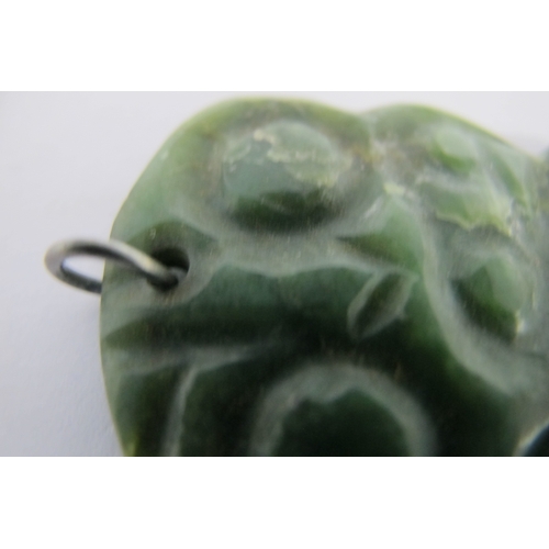 124 - A Maori (New Zealand) Carved Greenstone Hei-Tiki Pendant, (damage); together with a Blue John slice,... 