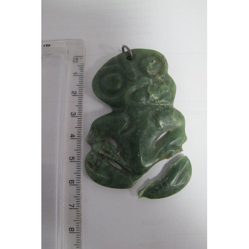 124 - A Maori (New Zealand) Carved Greenstone Hei-Tiki Pendant, (damage); together with a Blue John slice,... 