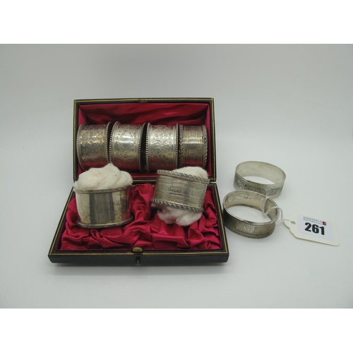 261 - A Pair of Hallmarked Silver Napkin Rings, with gadrooned edge and engine turned decoration, containe... 