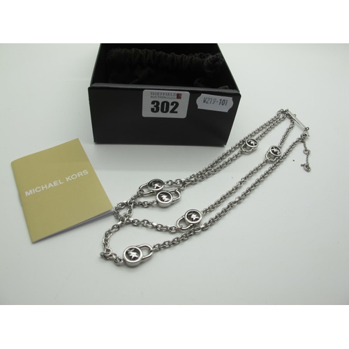 302 - Michael Kors; A long chain with 