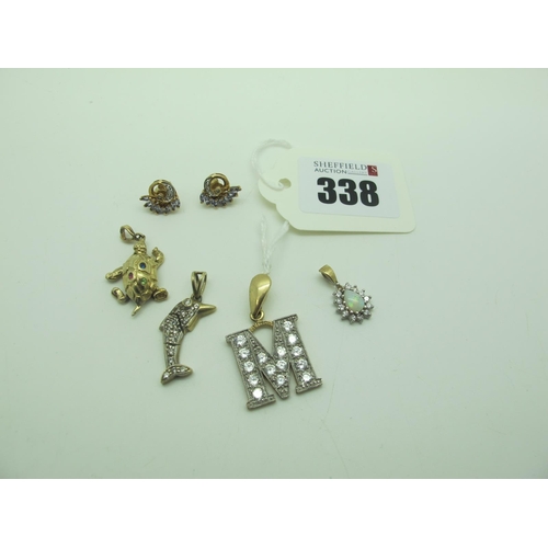 338 - A 9ct Gold 'M' Initial Pendant, with inset highlights, together with novelty charm pendants, decorat... 