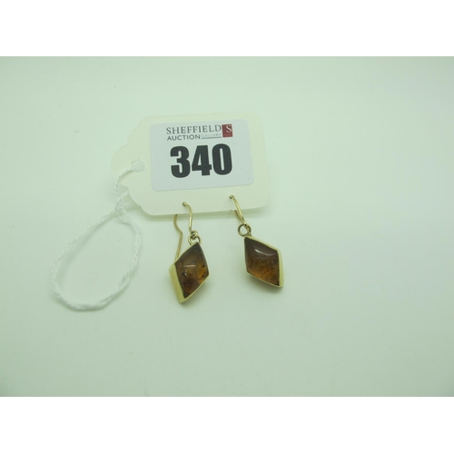 340 - A Pair of Modern Amber Set Earrings, lozenge collet set, stamped 