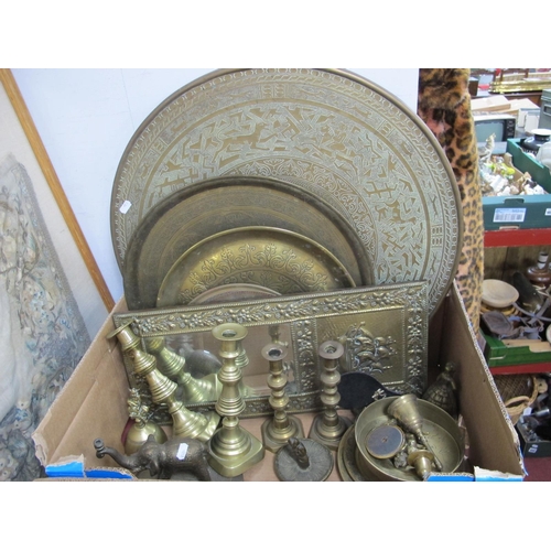 1047 - XIX Century Brass Candlesticks, Persian style brass plates, brass table top, bells:- One Box.