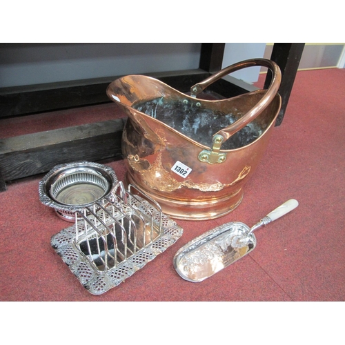 1302 - A XIX Century Copper Coal Helmet, mother of pearl handled crumb scoop, toast rack, plate on copper b... 