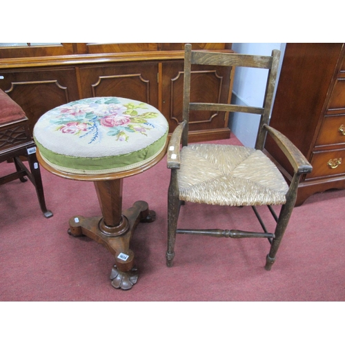 1624 - A XIX Century Mahogany Revolving Piano Stool, with circular tapestry top tapering octagonal support ... 