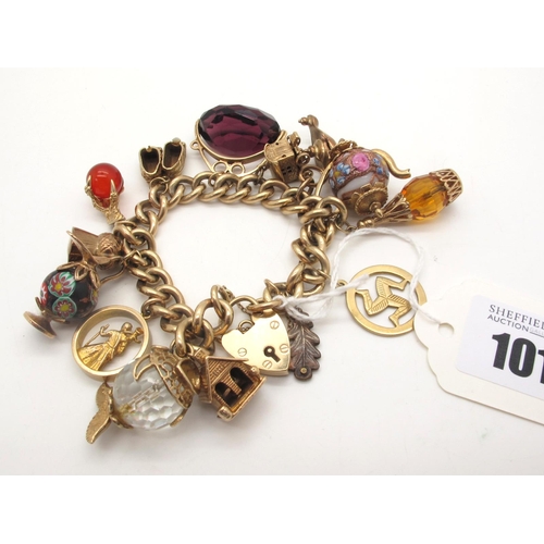 101 - A 9ct Gold Solid Curb Link Charm Bracelet, to 9ct gold heart shape padlock style clasp, suspending n... 