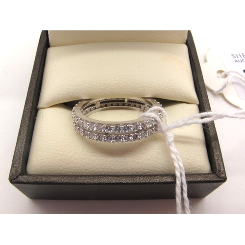 103 - A Modern 18ct White Gold Two Row Band, claw set throughout (finger size L1/2).