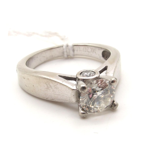 104 - A Modern Single Stone Diamond Ring, the brilliant cut stone four claw set high between plain shoulde... 