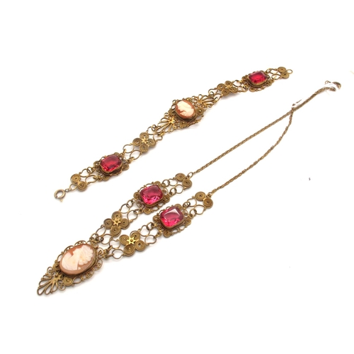 67 - A Vintage Italian Gilt Filigree Cameo Necklace, oval collet set to the centre with an oval shell car... 