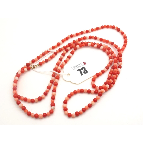 73 - A Long Single Strand Uniform Coral Bead Necklace, varying colour beads, to clasp stamped 