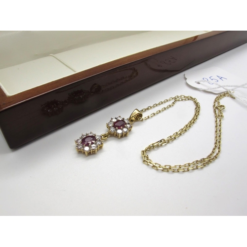 85A - A Modern Ruby and Diamond Double Cluster Drop Pendant, each cluster oval claw set within border of b... 