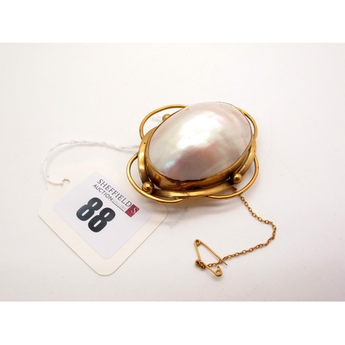 88 - A Large Antique Shell Brooch, oval collet set within openwork setting.