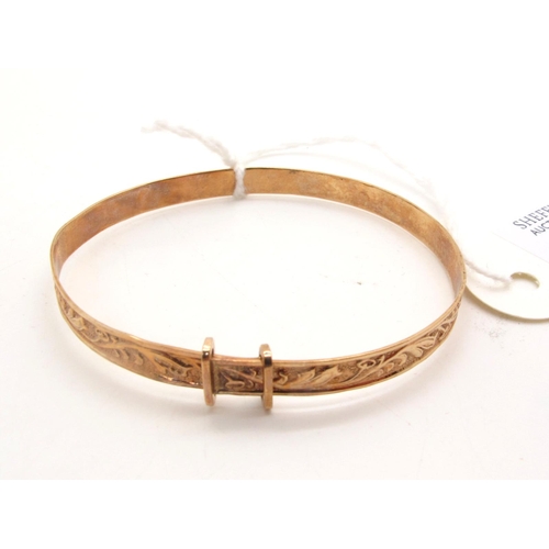 93 - A 9ct Gold Child's Expanding Bangle, allover leaf scroll decoration (2.8grams).
