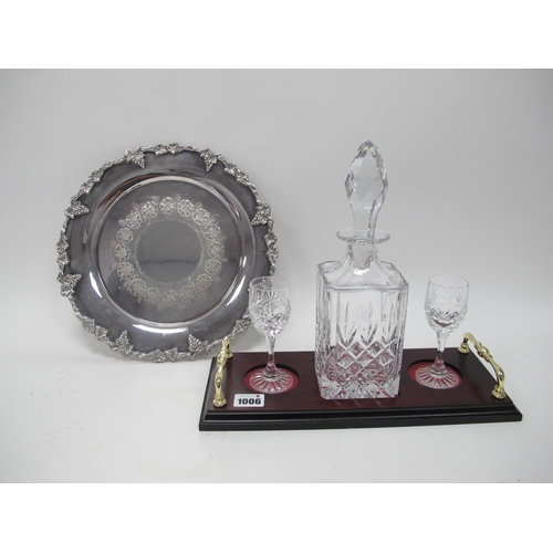 1006 - A Modern Glass Square Decanter and Stopper and a Pair of Matching Glasses, upon a two handled mahoga... 