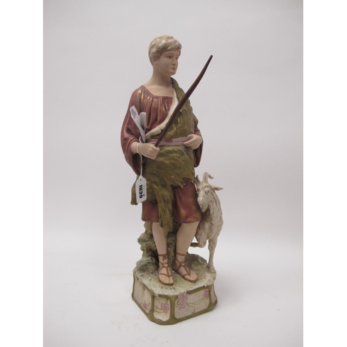 1039 - A Royal Dux Pottery Figure of a Shepherd Boy Standing Beside a Goat, raised on naturalistic square b... 