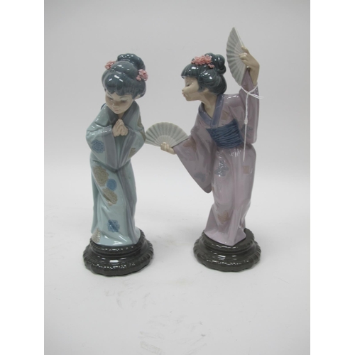 1087 - Two Lladro Japanese Geisha Figures, one with fans, 29.5cm high, the other praying. (2).