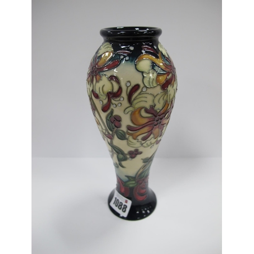 1088 - A Modern Moorcroft Pottery Vase, painted in the 'Honeysuckle' pattern, of  elongated ovoid form, imp... 