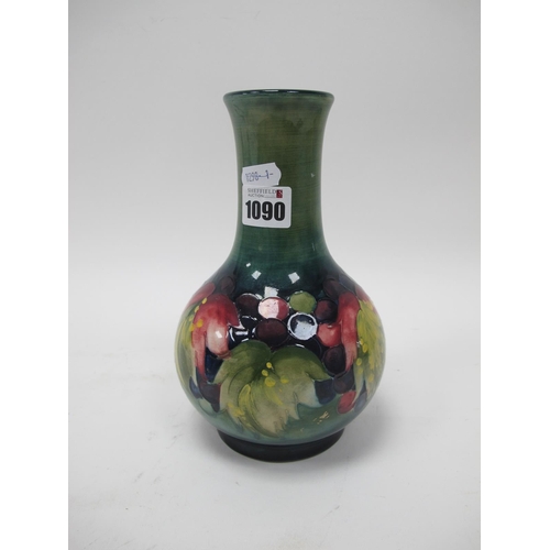 1090 - A Moorcroft Pottery Vase, of pear shape, painted in the Leaf and Grape pattern against a shaded gree... 