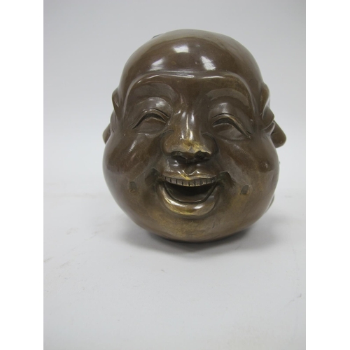 1133 - Oriental Brass Four Face Paperweight, with differing expressions to each side, 10.5cm high.