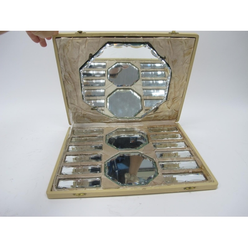 1141 - A 1930's Fitted Box, containing fifteen mirror glass stands, three of octagonal form and twelve rect... 