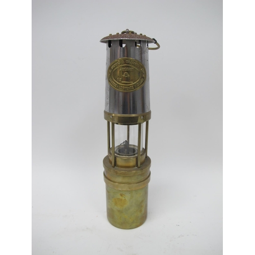 1180 - Miners Lamp, E. Thomas & Williams of Aberdare, N 297718, with brass lower body, 34cm high, with hand... 