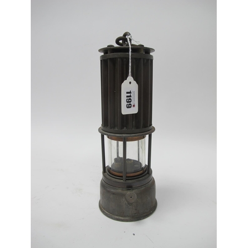 1199 - Miners Lamp, the Premier Lamp, Leeds, with  corrugated upper body, 26cm high with handle down.