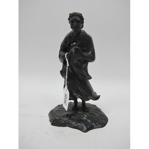 1275 - A Late XIX Century Japanese Bronze Figure of a Sage, in flowing robes, his hands clasped, upon a roc... 