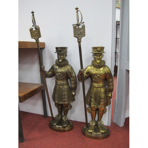 1286 - A Pair of Mid XX Century Brass Beefeater Fireside Figures, each holding a poker in the form of a swo... 