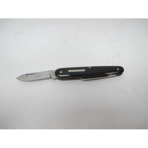 1309 - Stan Shaw: A Two Blade Knife, with polished horn scales and brass linings, 8.5cm closed.