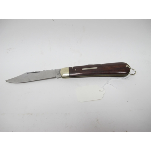 1312 - Stan Shaw: A Lock Knife, with hardwood scales, nickel silver bolster and lanyard ring, brass worked ... 