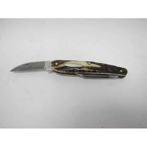 1313 - Stan Shaw: A Whittler Knife, with three blades, stag scales and brass linings, 9cm closed.