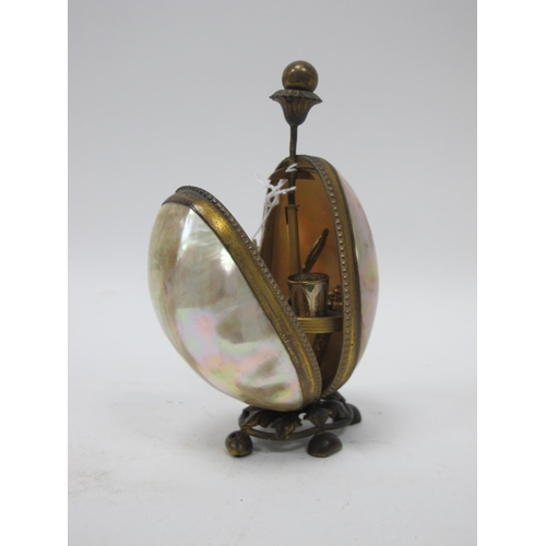 1328 - A Late XIX Century Sewing Stand, the egg shaped mother of pearl case with gilt metal mounts opening ... 