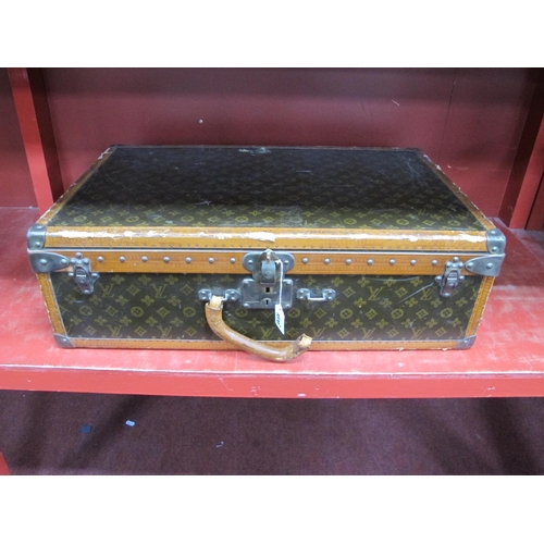 1370 - A Louis Vuitton Suitcase, with pull-out tray with straps, paper label numbered 802926, lock numbered... 