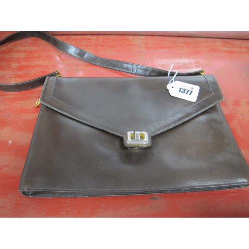 1377 - A Vintage Christian Dior Brown Leather Handbag, of envelope style with gilt logo clasp and flat leat... 