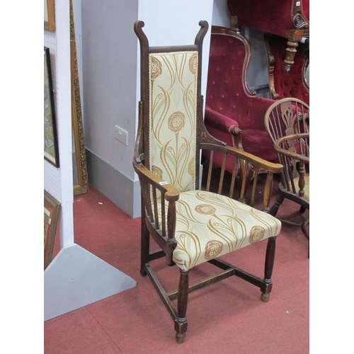 1483 - An Art Nouveau Oak Armchair, with upholstered back and seat, shaped arms and spindle supports on tur... 