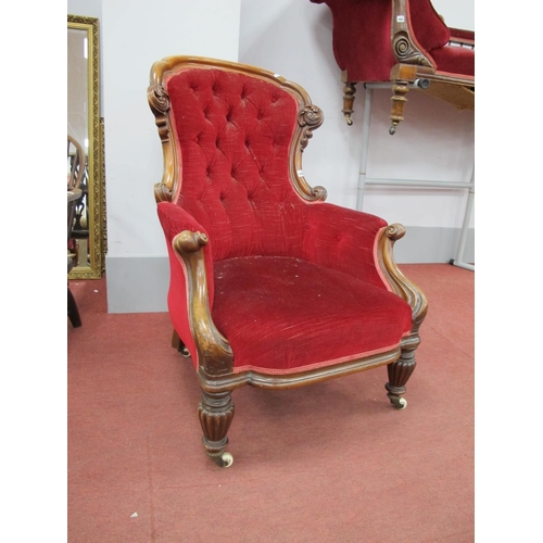 1486 - A Mid XIX Century Mahogany Armchair, with a shaped and scroll back and scroll arms on turned support... 