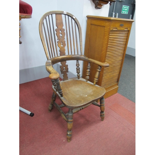 1488 - A XIX Century Ash and Elm Pad Arm Windsor Chair, with hooped back, pierced splat and pad arms on tur... 