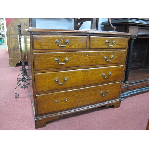 1504 - An Early XIX Century Oak Chest of Drawers, the top with moulded edge over two short and three long d... 